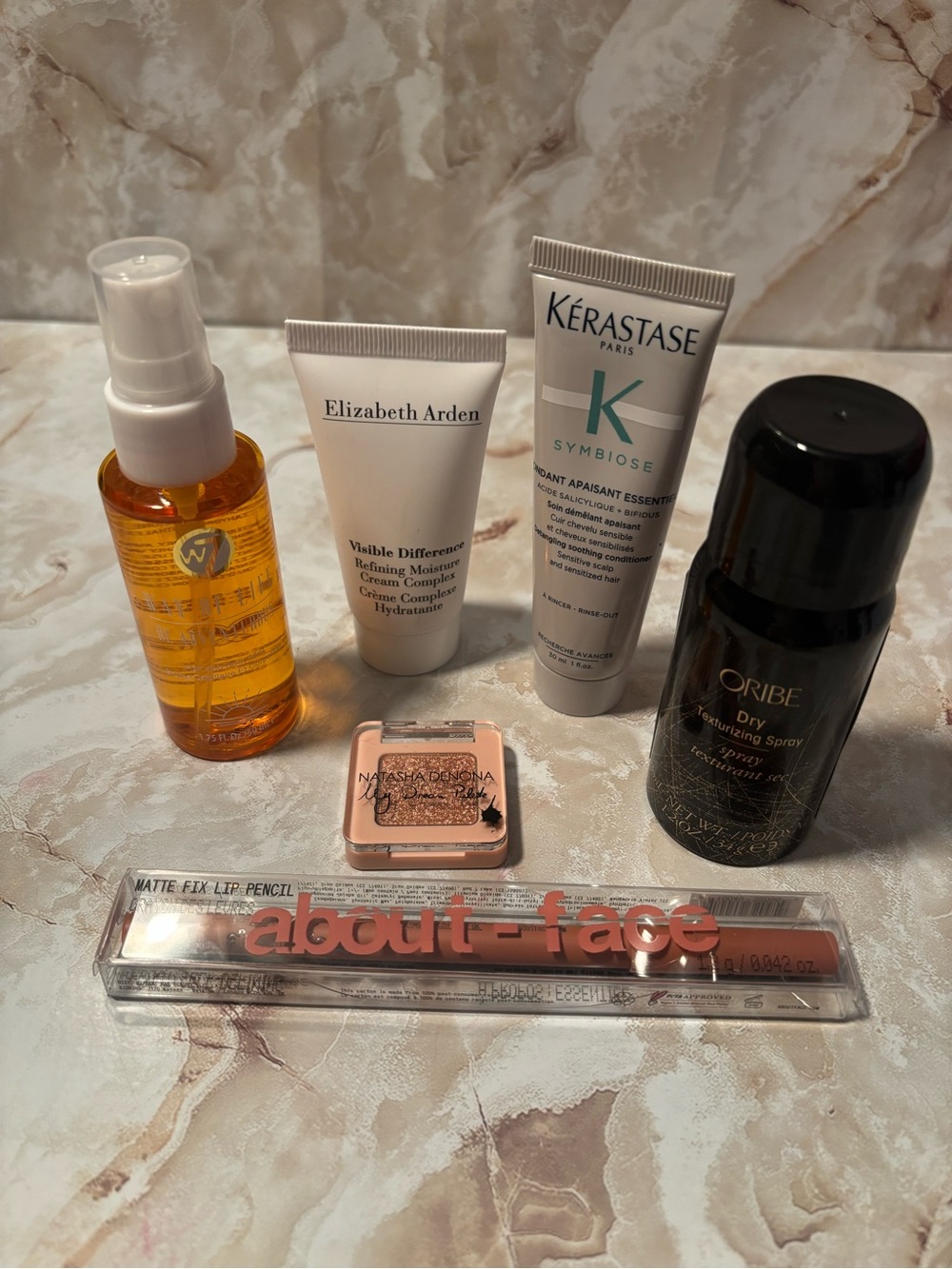 Package of various beauty items kerastase,Elizabeth Arden, oribe.